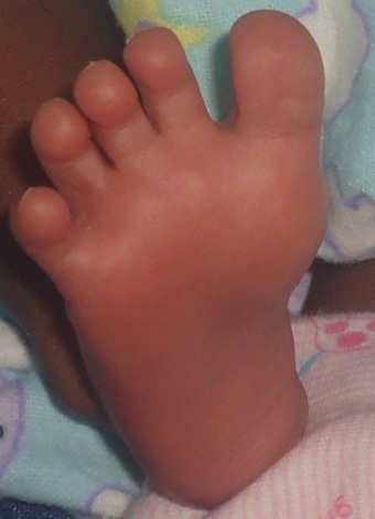Her bigass Opwonya foot when she was a few days old. 